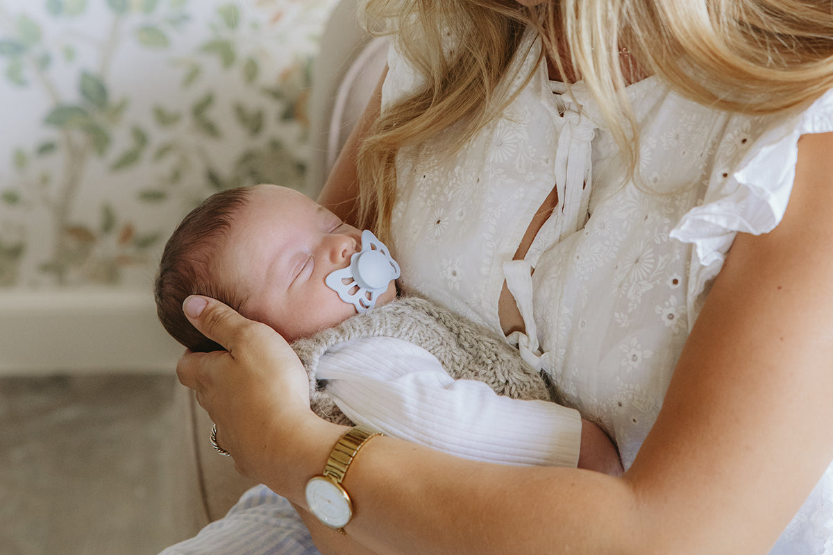 FRIGG pacifiers in a calm nursery setting